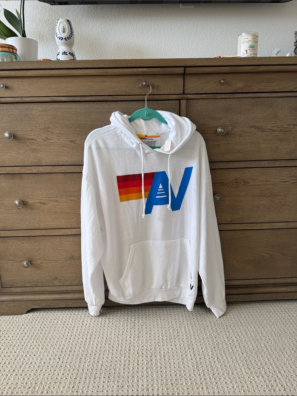 Aviator Nation White Hoodie with Blue AV and Red-Orange-Yellow Stripe